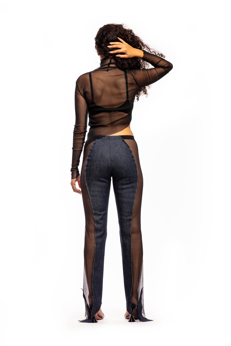 ASYMMETRIC RAW TURTLENECK IN BLACK MESH